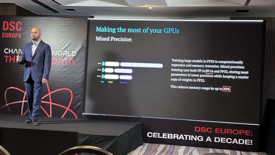 The speaker beside a slide reading Making the most of your GPUs, on mixed precision