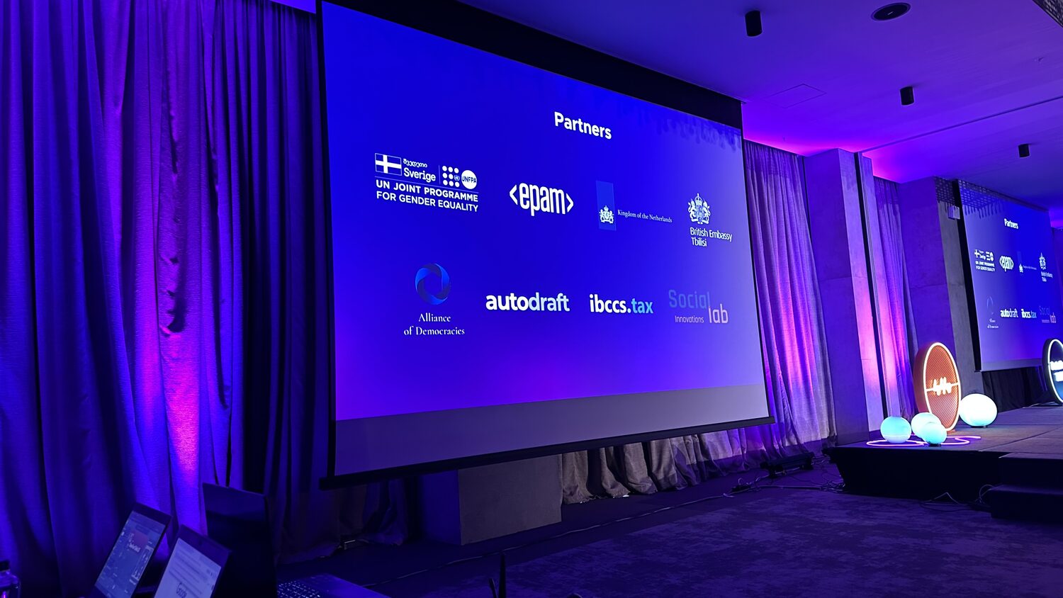Partners slide on the main screen listing the UN Joint Programme for Gender Equality, EPAM, the Kingdom of the Netherlands and the British Embassy Tbilisi