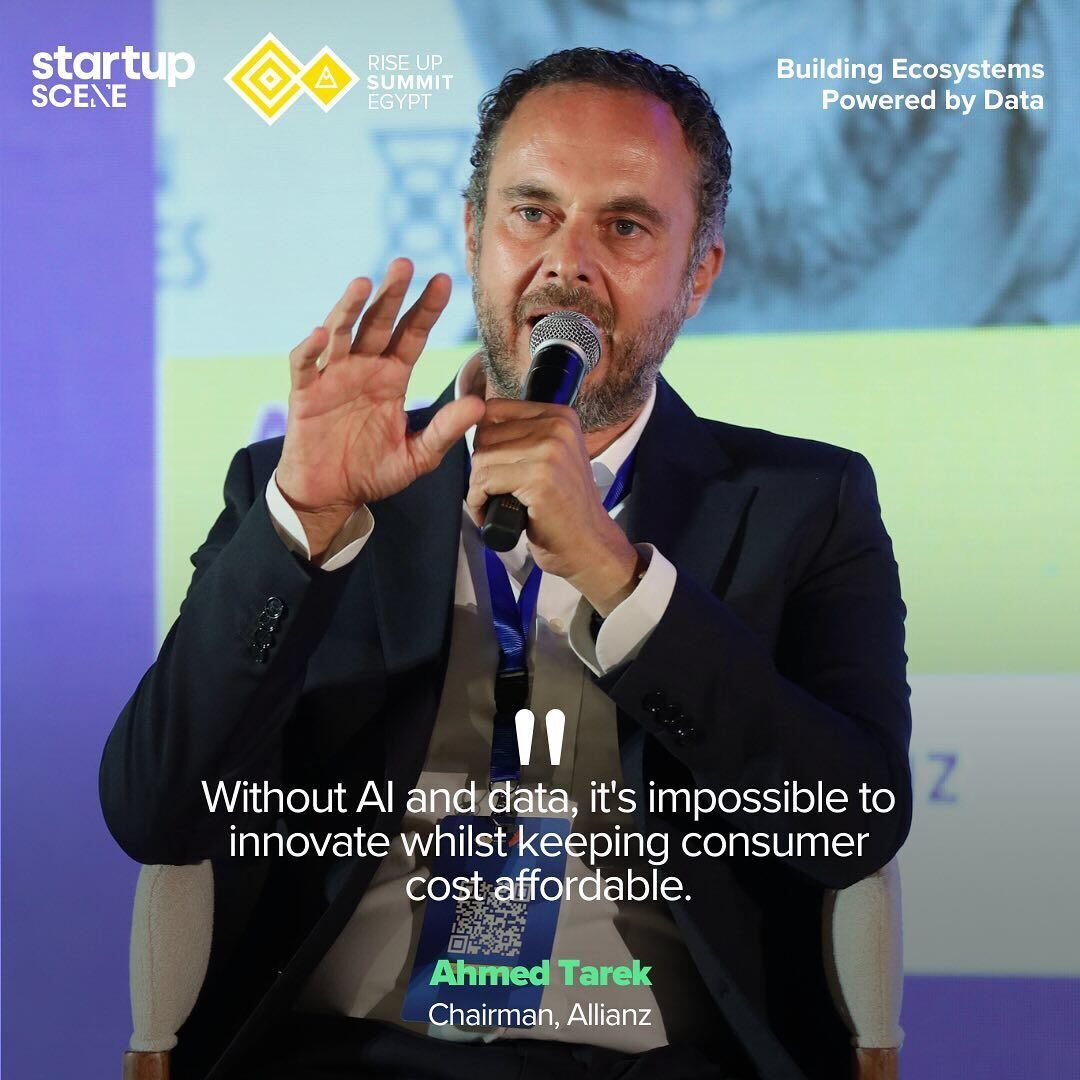 Ahmed Tarek, chairman of Allianz, speaking into a microphone on the summit panel