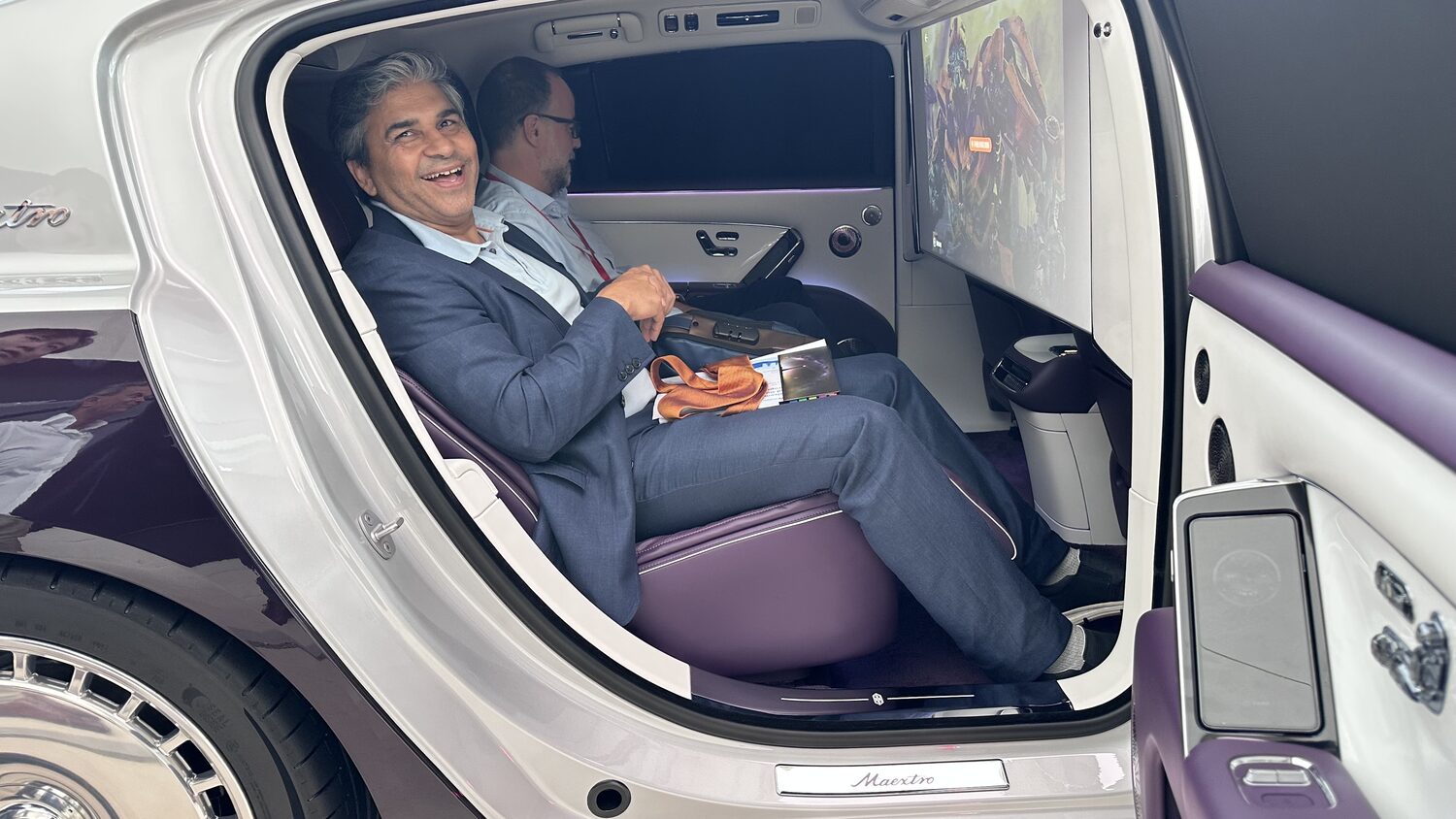 A delegate seated in the rear cabin of the Maextro saloon during the showroom visit, Shenzhen, 30 June.