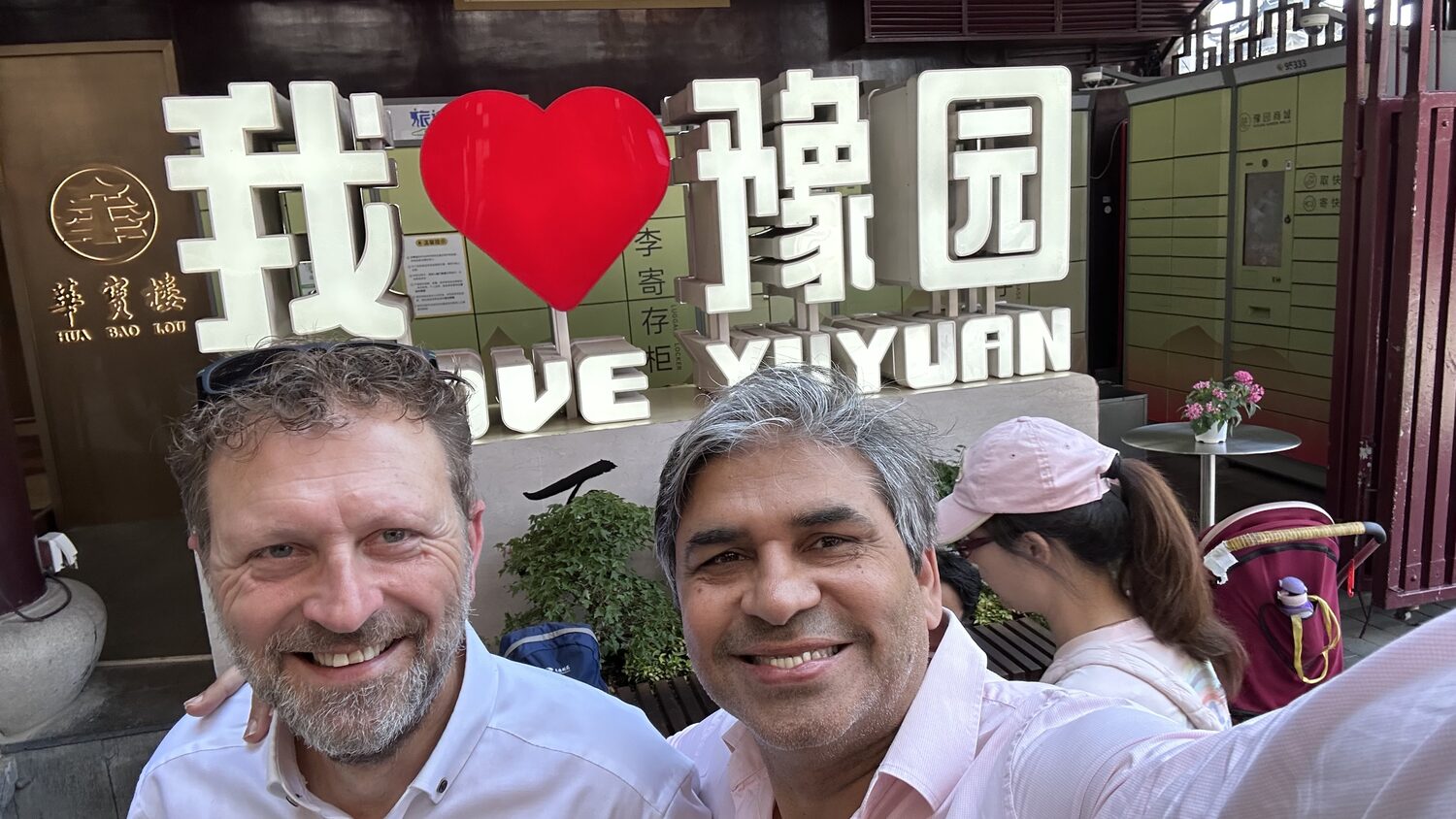 Two delegates at the I love Yuyuan sign, Shanghai, 3 July morning.