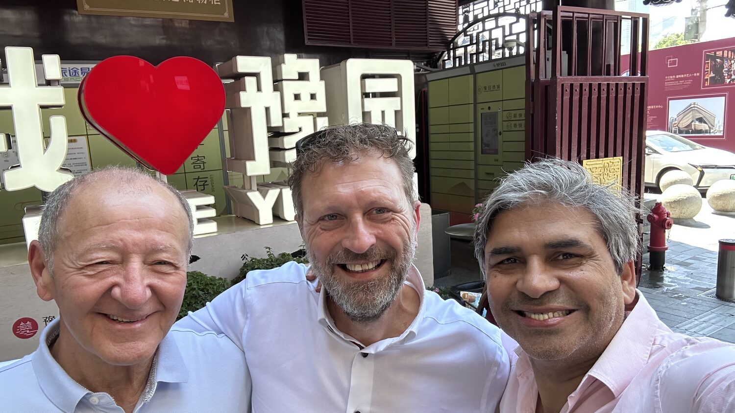 Three delegates at the I love Yuyuan sign, Shanghai, 3 July morning, a different grouping fifteen seconds later.