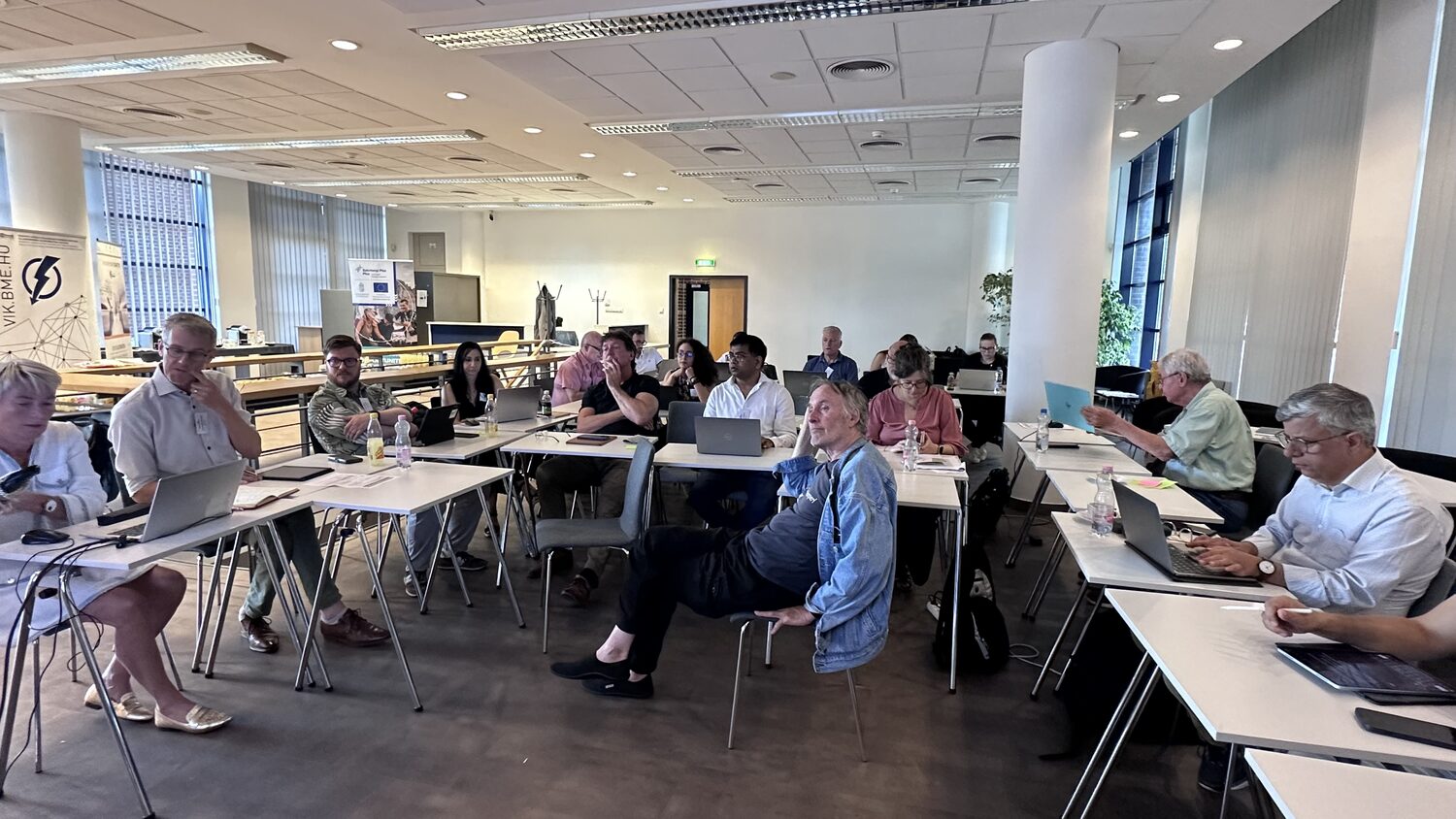 The worksprint room on the second morning, partners at their desks with laptops open.