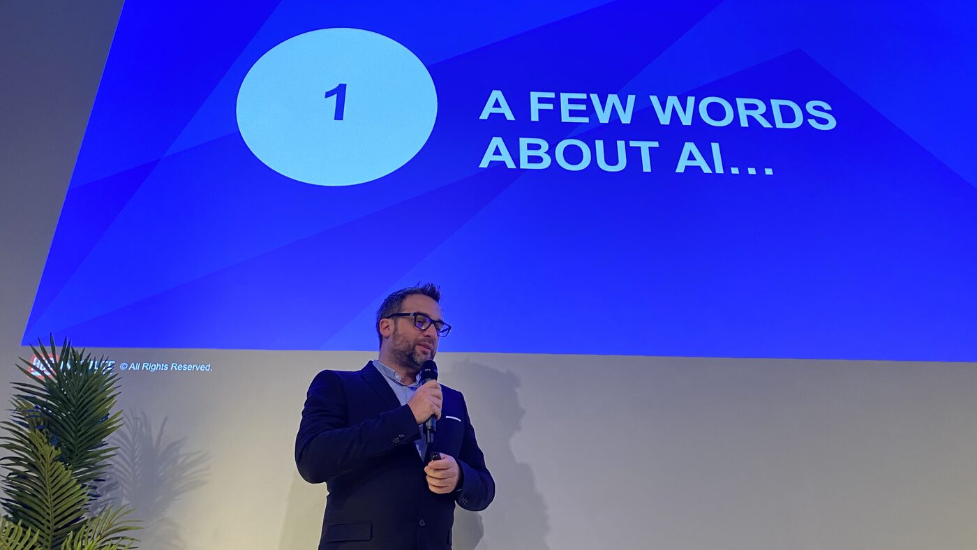 The host's opening section slide, numbered one, reading A FEW WORDS ABOUT AI, with the HUB Institute copyright line at the foot of the screen.