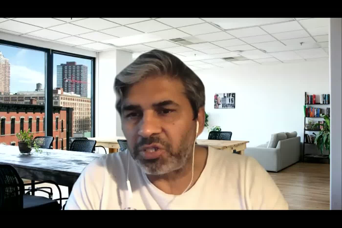 Tarry Singh on camera during the Zoom session, wearing earphones.