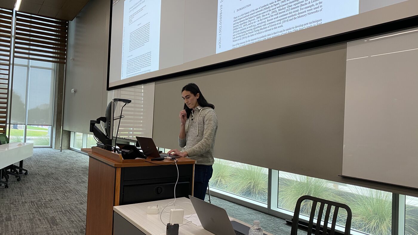 A participant taking the lectern to present.