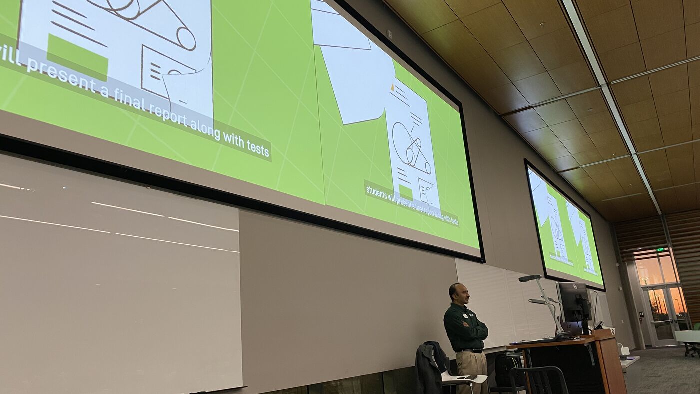 A slide on the hall's screen during the closing session.